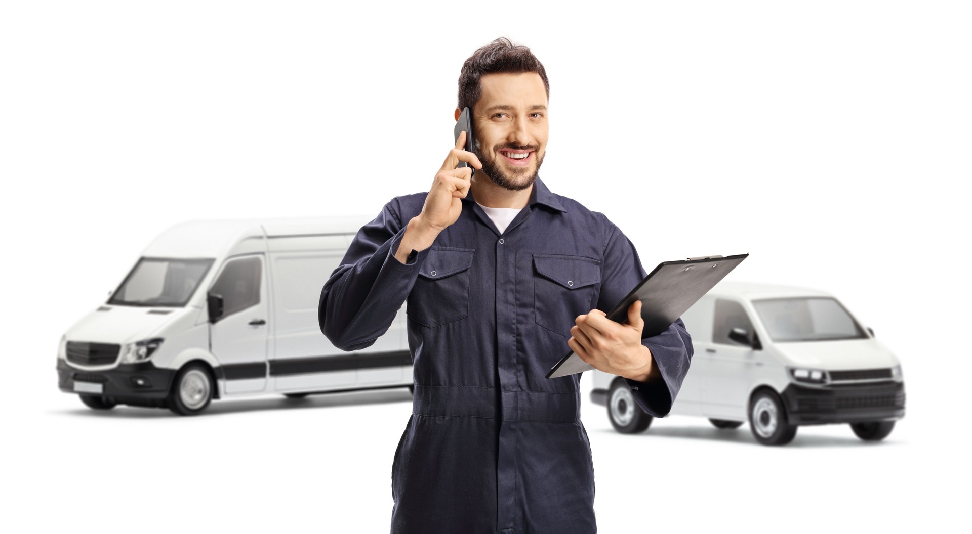 Van driver in a blue uniform using a mobile phone and holding a clipboard